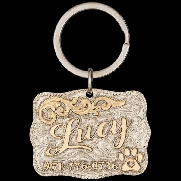 Elevate your pet's ID game with the Lucy Custom Dog Tag! Crafted from durable German silver, adorned with bronze letters and adorable paw designs. Keep your furry friend safe and stylish. Order now!